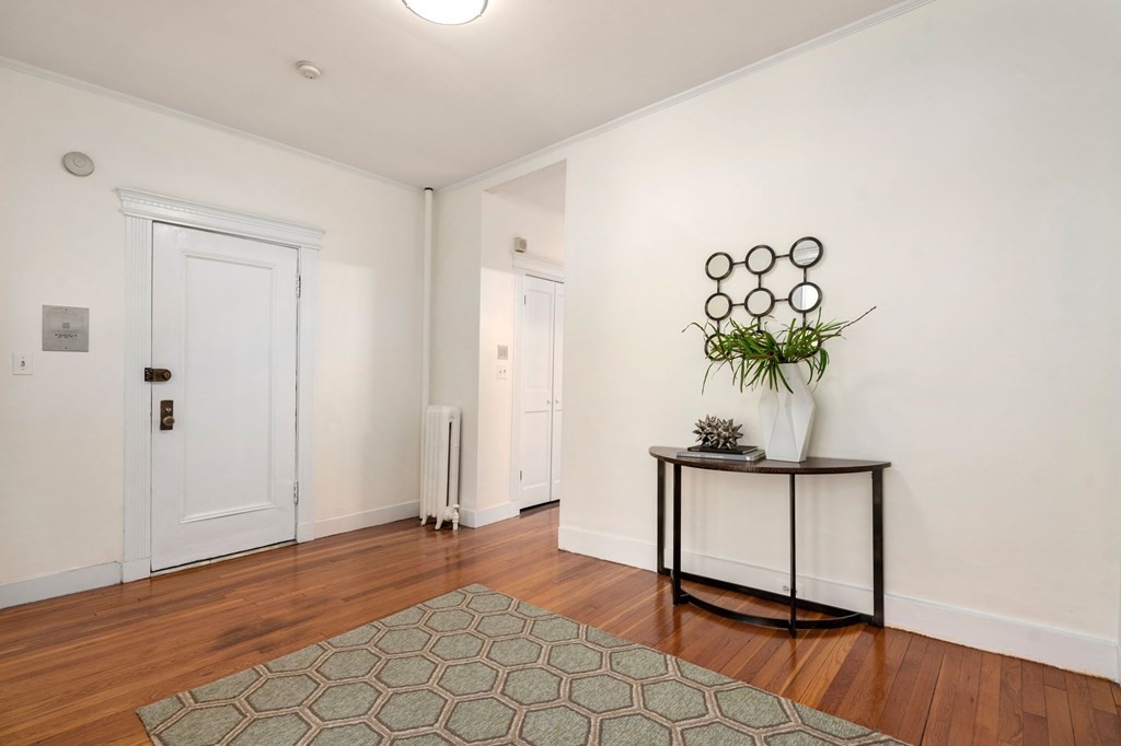 384 Riverway, Unit 5 Boston, MA 02115 - Photo 9 of 20 a view of entryway with wooden floor