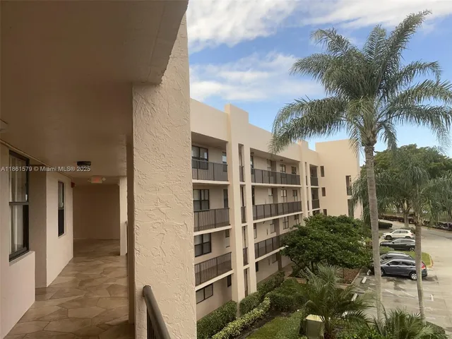 a view of a swimming pool with a table and chairs