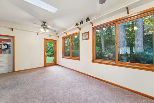 a view of a workspace with furniture and wooden floor