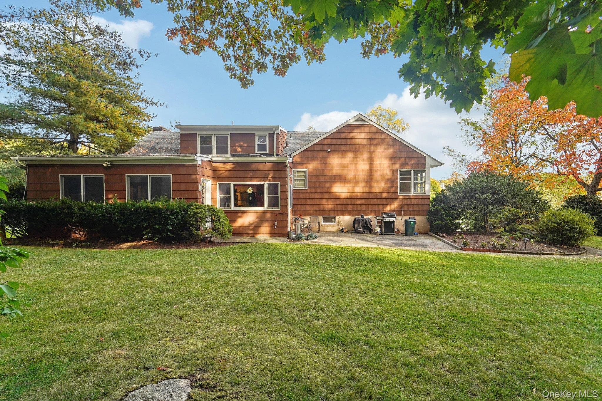 24 Pamela Lane New Rochelle, NY 10804 - Photo 24 of 34 a view of a house with a backyard