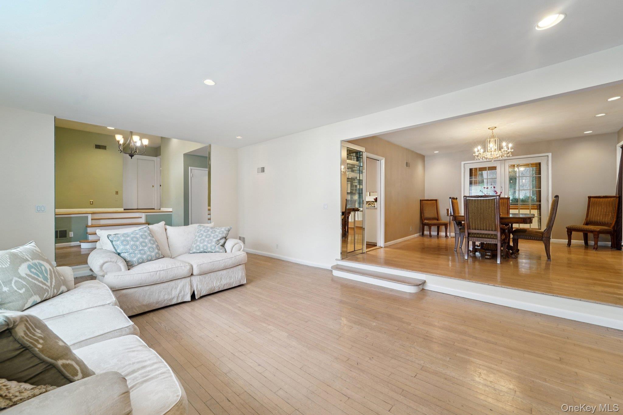 24 Pamela Lane New Rochelle, NY 10804 - Photo 5 of 34 a living room with furniture and a wooden floor