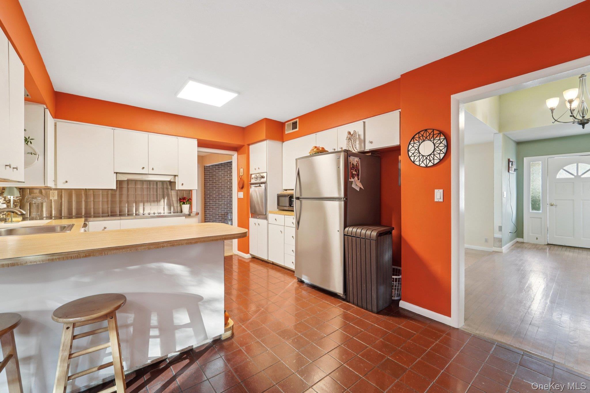 24 Pamela Lane New Rochelle, NY 10804 - Photo 9 of 34 a kitchen with stainless steel appliances granite countertop a refrigerator and a stove