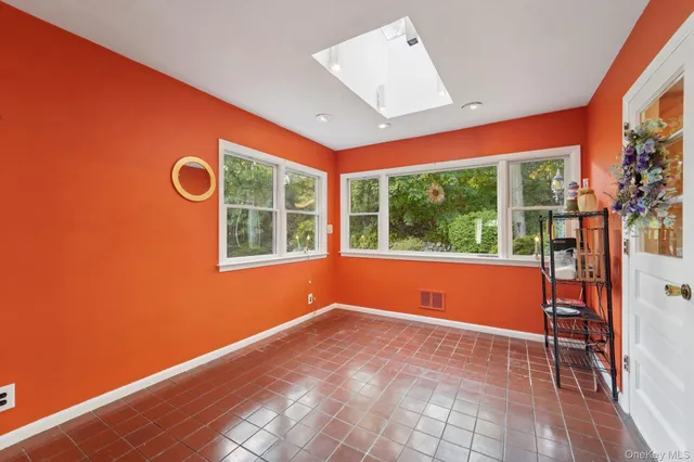 a bathroom with a toilet a sink and curtain