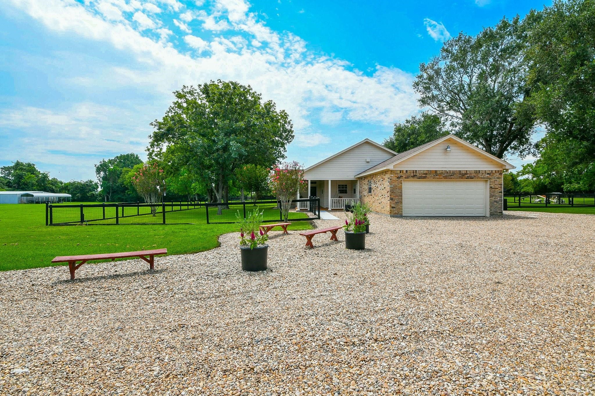 22035 Buescher Road Tomball, TX 77377 - Photo 7 of 43 a view of a house with backyard and a garden