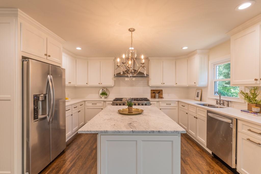 645 River Chase Ridge Sandy Springs, GA 30328 - Photo 1 of 1 Beautiful designer kitchen with marble island, quartz counters and 48 inch gas range, opens to the vaulted family room.