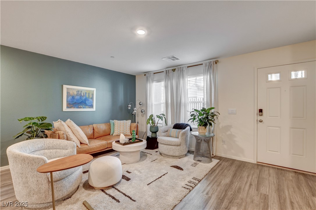 Living room with light wood-style floors