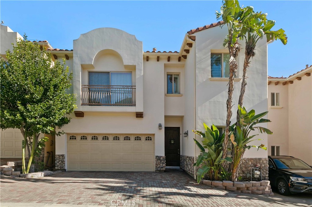 6920 Valmont Street, Unit 5 Tujunga, CA 91042 - Photo 1 of 69 a front view of a house with a garden