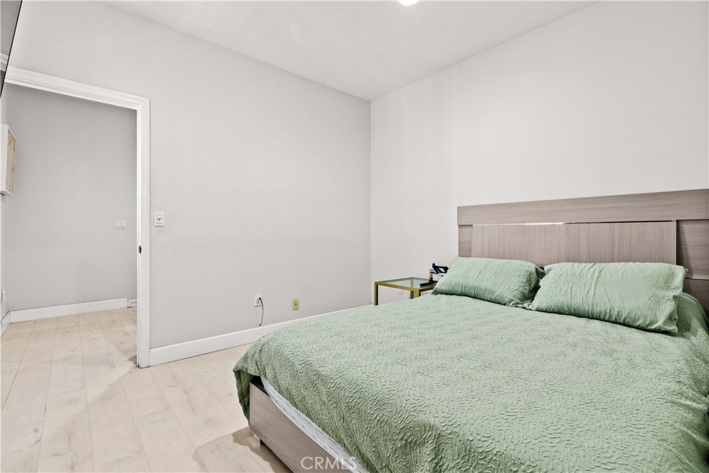 6920 Valmont Street, Unit 5 Tujunga, CA 91042 - Photo 44 of 69 a bedroom with a bed and a window