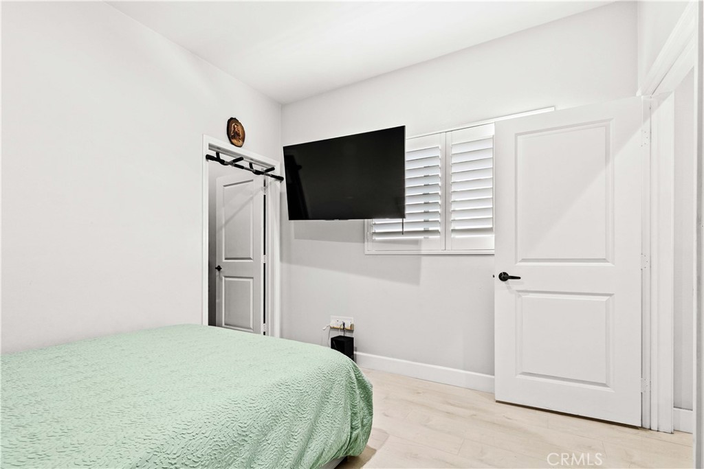 6920 Valmont Street, Unit 5 Tujunga, CA 91042 - Photo 45 of 69 a bedroom with a bed and a flat screen tv