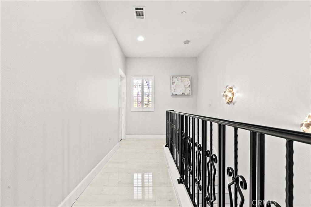 6920 Valmont Street, Unit 5 Tujunga, CA 91042 - Photo 47 of 69 a view of a hallway with windows