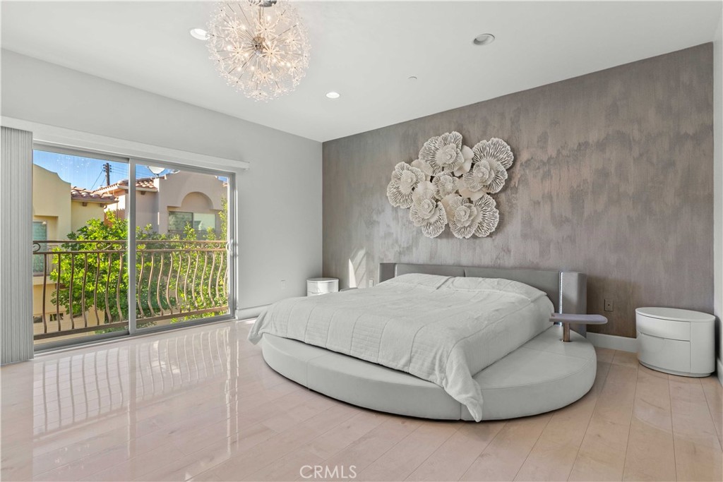 6920 Valmont Street, Unit 5 Tujunga, CA 91042 - Photo 50 of 69 a bedroom with a bed and a large window
