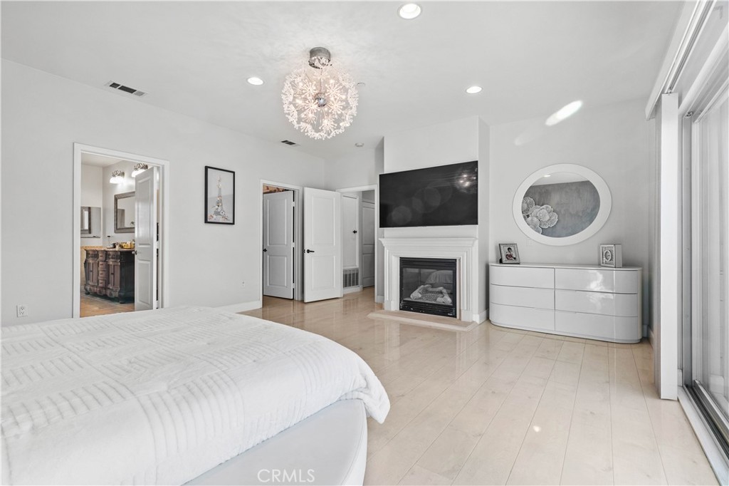 6920 Valmont Street, Unit 5 Tujunga, CA 91042 - Photo 54 of 69 a spacious bedroom with a bed and a flat screen tv