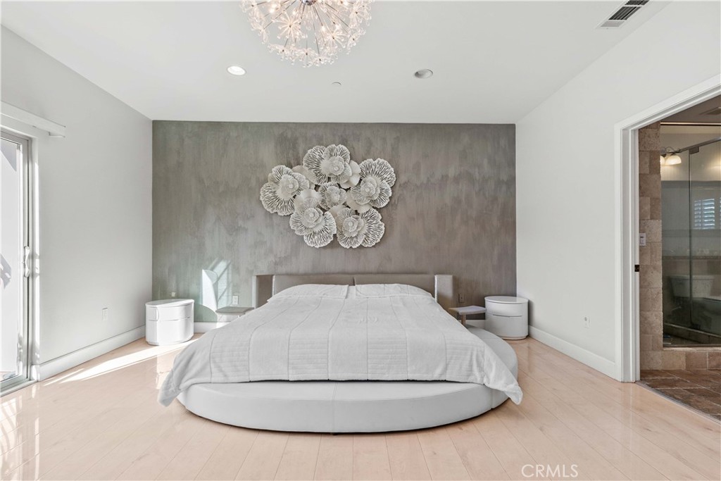 6920 Valmont Street, Unit 5 Tujunga, CA 91042 - Photo 55 of 69 a picture of a room with a fireplace and wooden floor