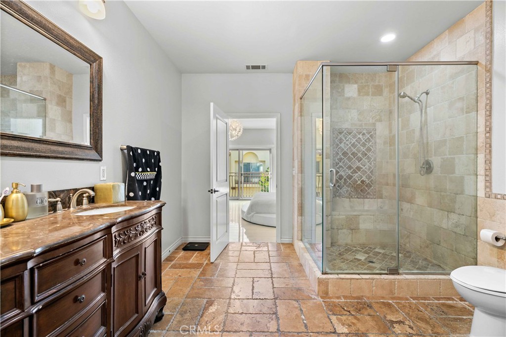 6920 Valmont Street, Unit 5 Tujunga, CA 91042 - Photo 59 of 69 a bathroom with a double vanity sink toilet and shower