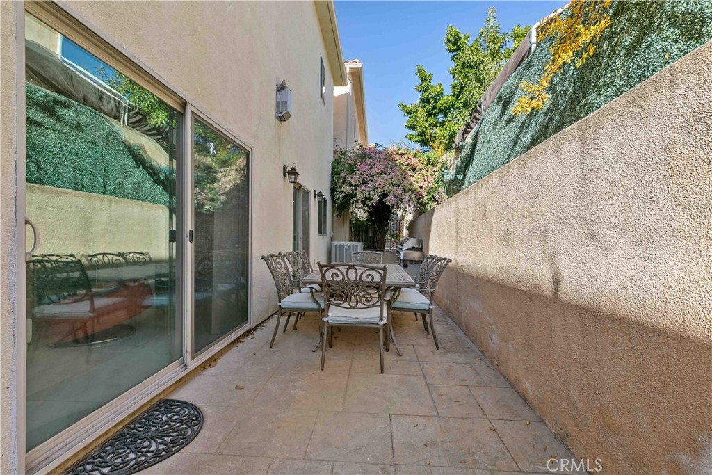 6920 Valmont Street, Unit 5 Tujunga, CA 91042 - Photo 64 of 69 a balcony with furniture and a potted plant