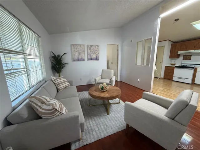 a kitchen with granite countertop wooden cabinets a stove top oven a sink and dishwasher