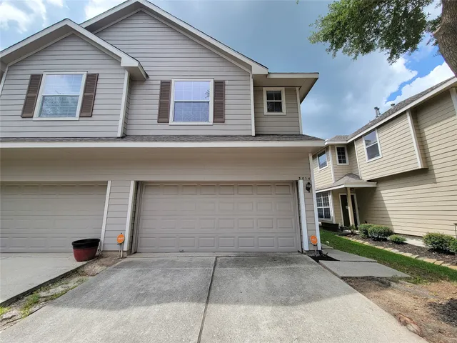 a front view of a house with a garage