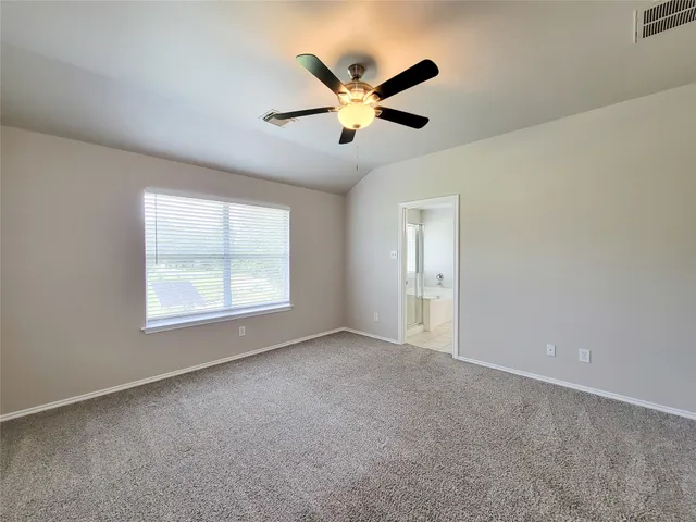 a spacious bathroom with a double vanity sink a mirror and a bathtub