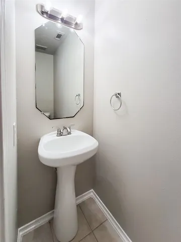 a bathroom with a sink and mirror