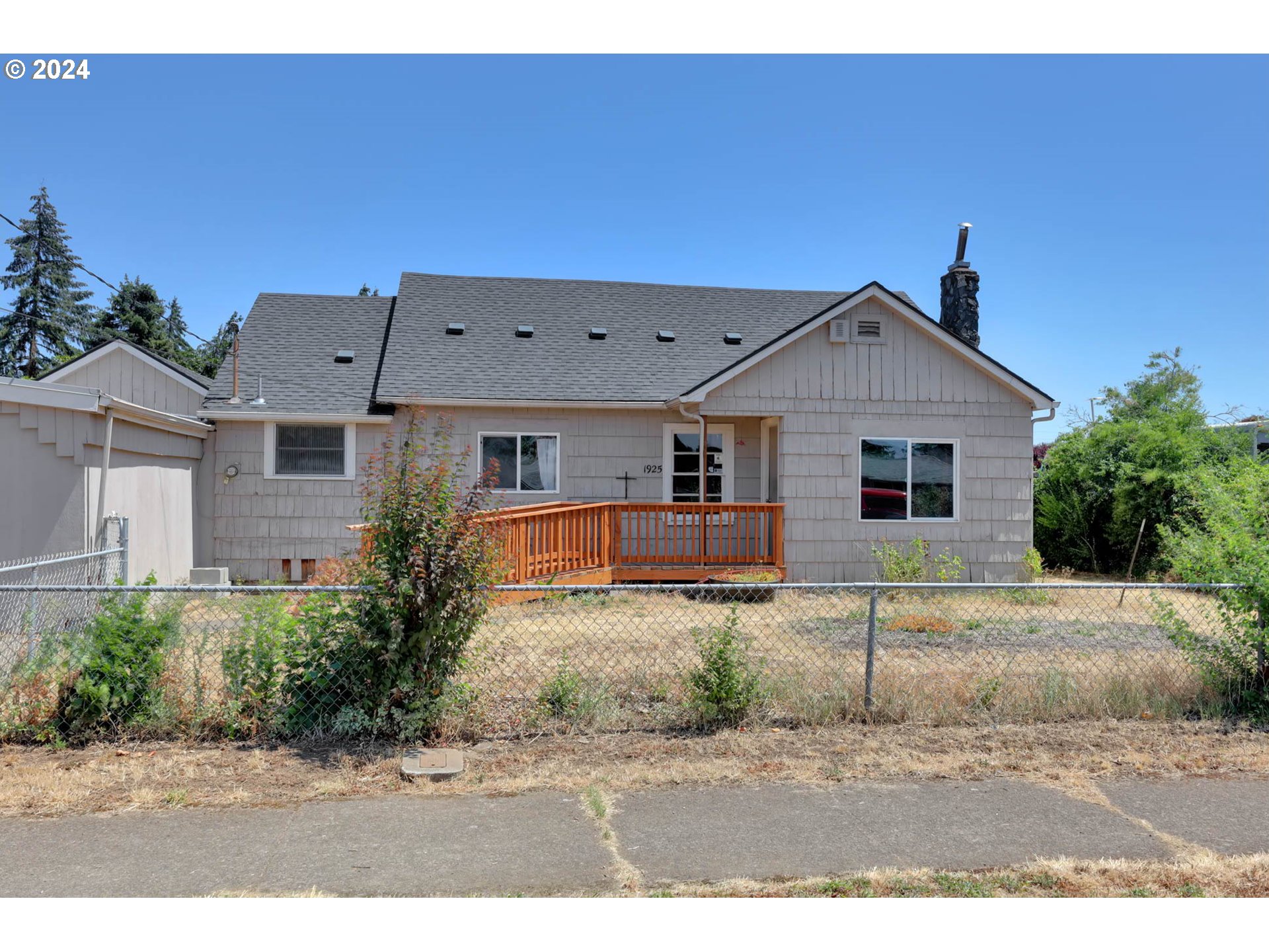 1925 15th Street Springfield, OR 97477 - Photo 3 of 26 a front view of a house with a yard