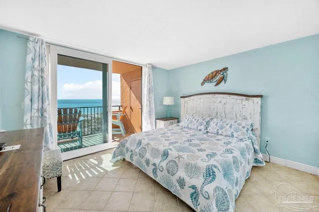 a spacious bedroom with a bed and a dresser