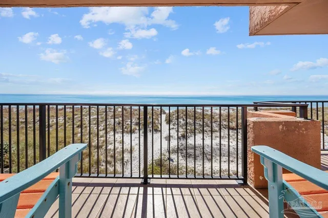 a balcony with furniture and city view