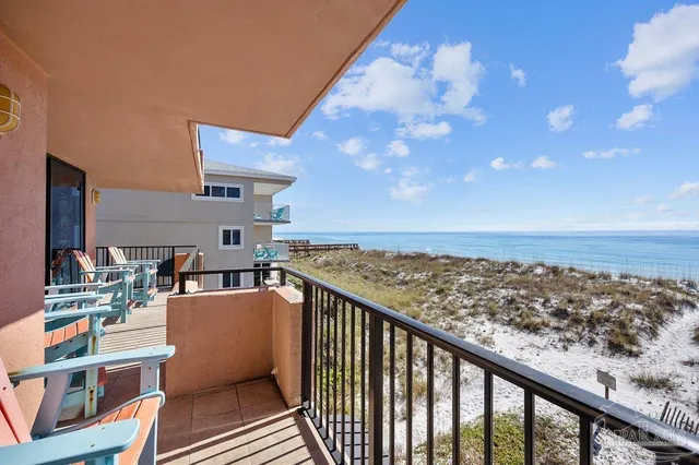 a view of balcony with wooden floor