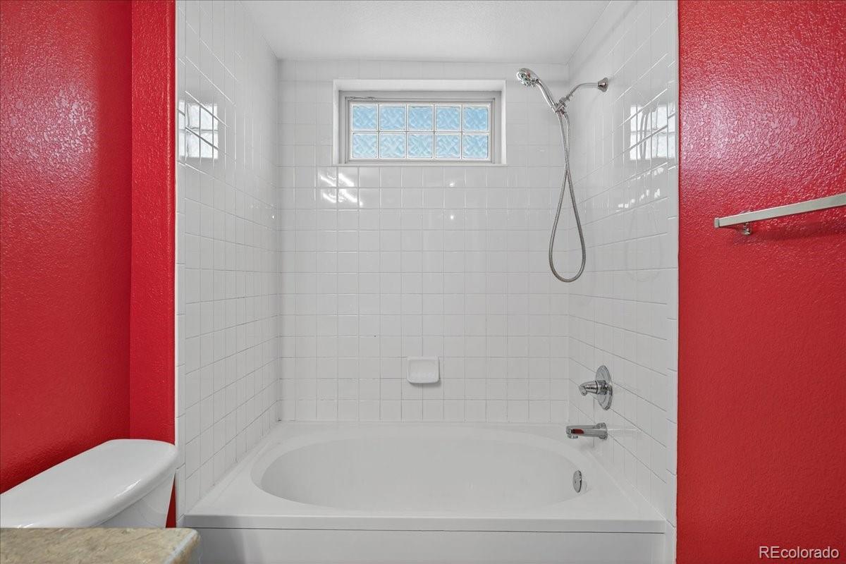 5800 Tower Road, Unit 2411 Denver, CO 80249 - Photo 12 of 28 a bathroom with a shower