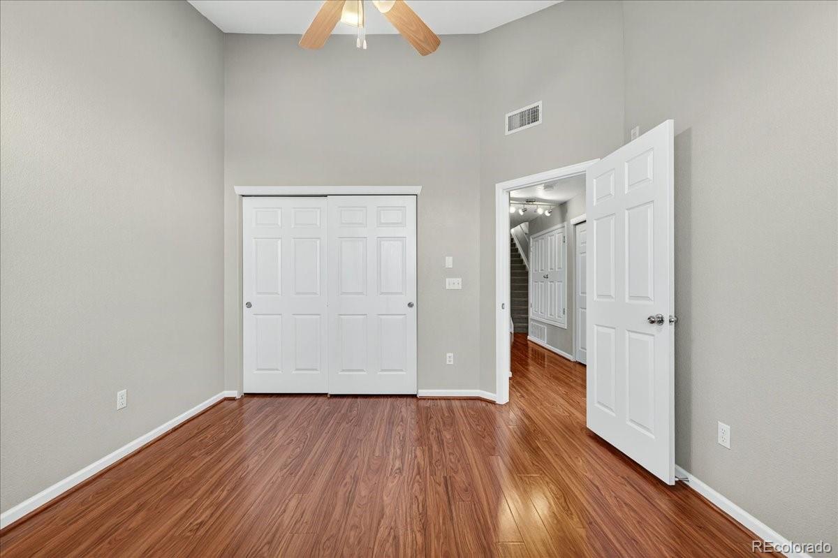 5800 Tower Road, Unit 2411 Denver, CO 80249 - Photo 15 of 28 wooden floor in an empty room