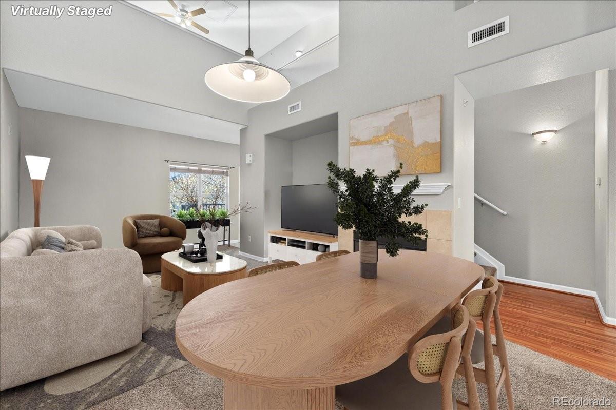 5800 Tower Road, Unit 2411 Denver, CO 80249 - Photo 3 of 28 a dining room with furniture and wooden floor