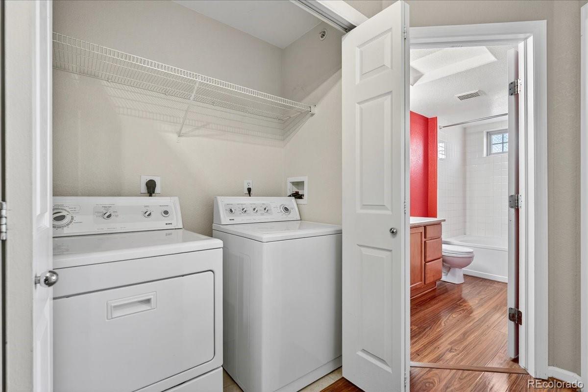 5800 Tower Road, Unit 2411 Denver, CO 80249 - Photo 10 of 28 a view of bathroom with a washer and dryer