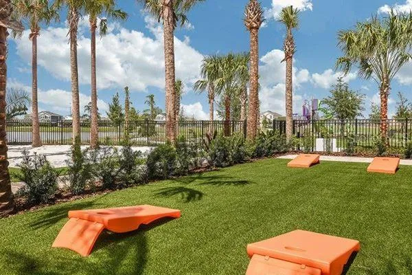 a view of a backyard with swimming pool