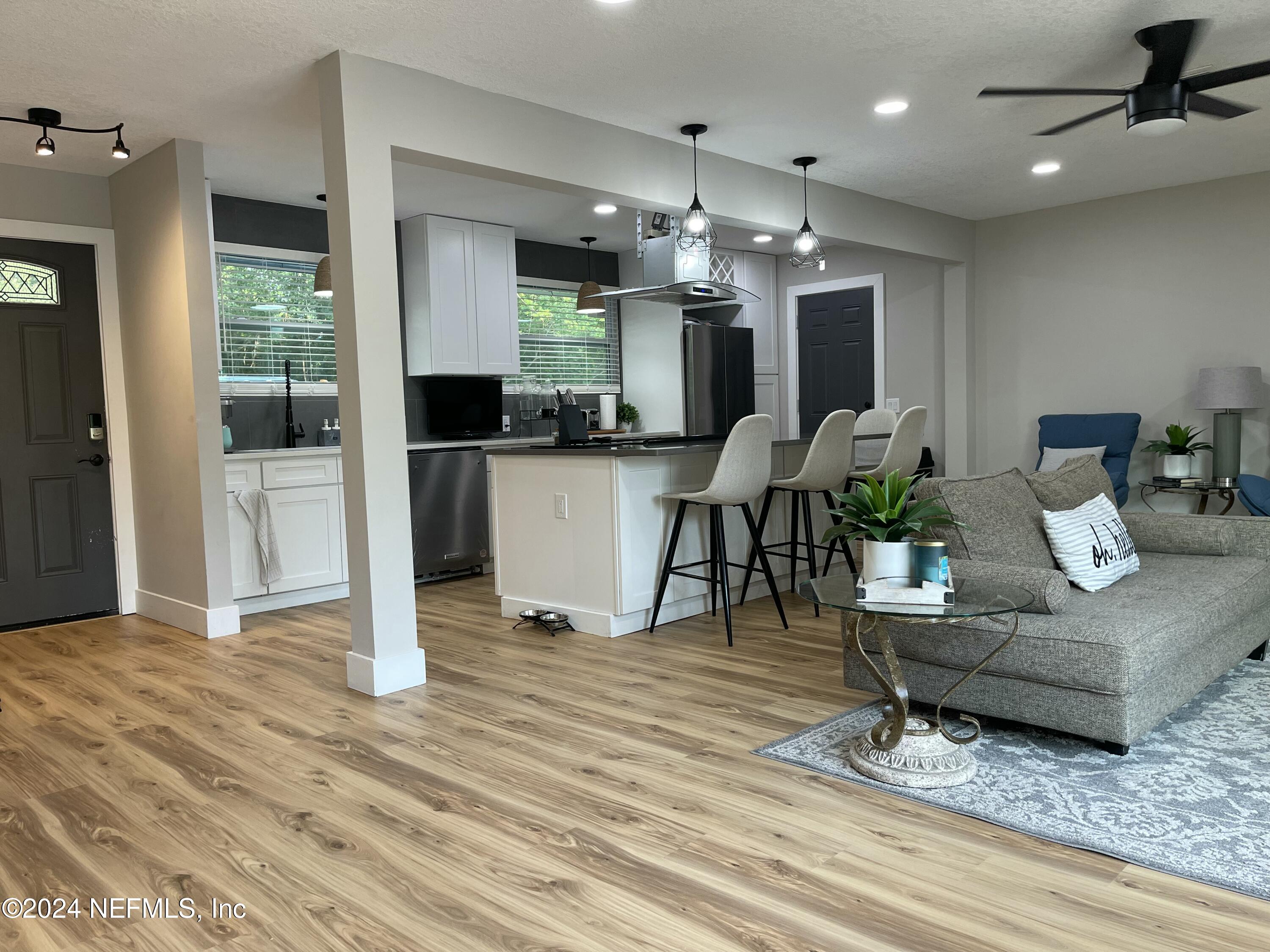 7566 Old Kings Road South Jacksonville, FL 32217 - Photo 1 of 30 a living room with furniture and a chandelier