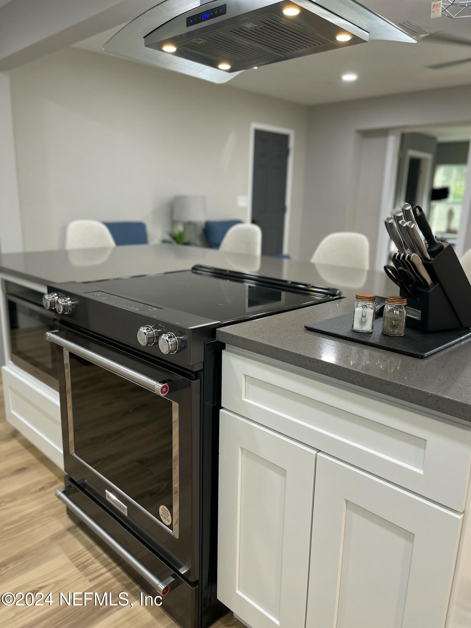 7566 Old Kings Road South Jacksonville, FL 32217 - Photo 13 of 30 a kitchen with a stove and a sink