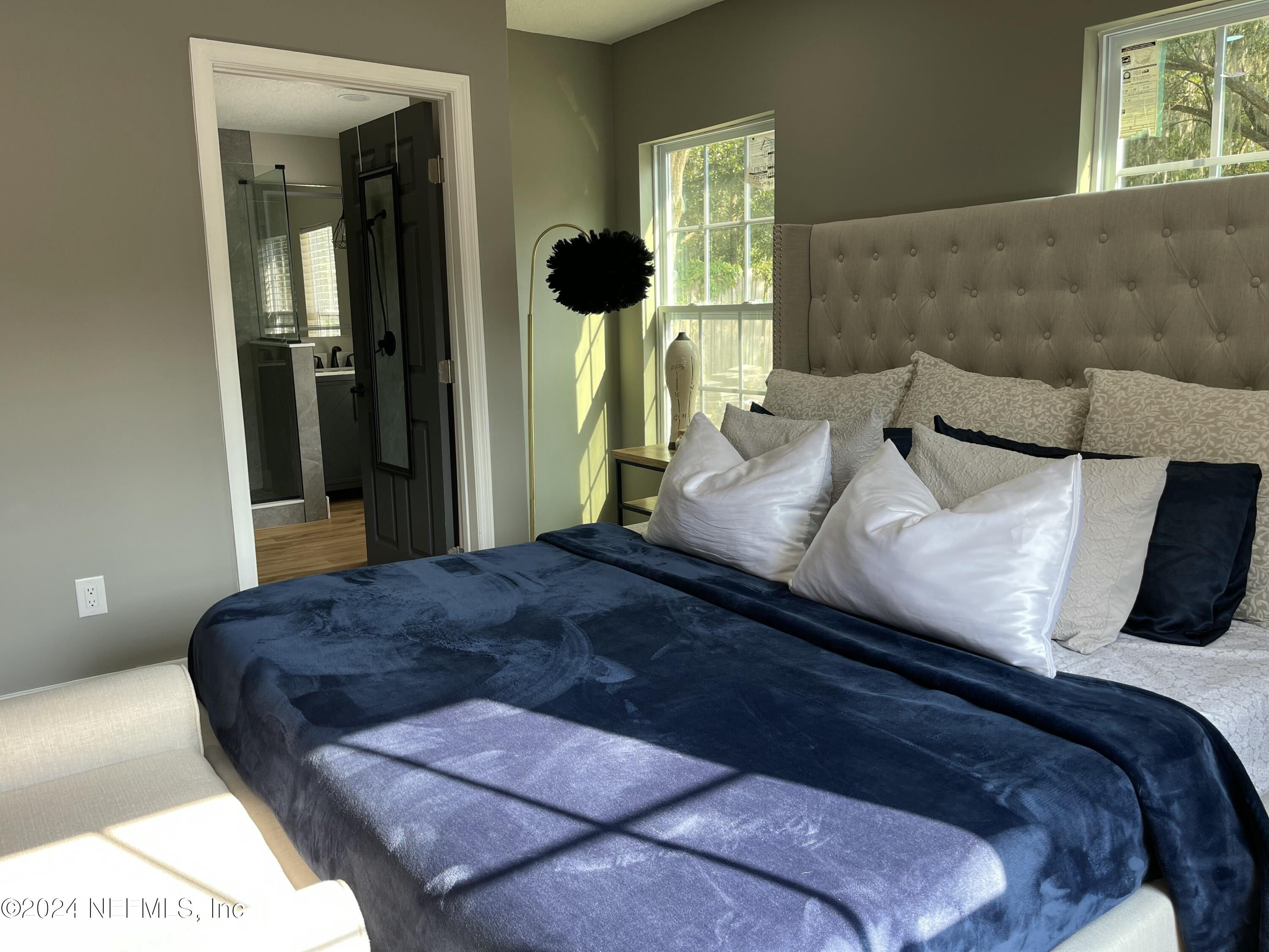 7566 Old Kings Road South Jacksonville, FL 32217 - Photo 20 of 30 a bedroom with a bed and a window