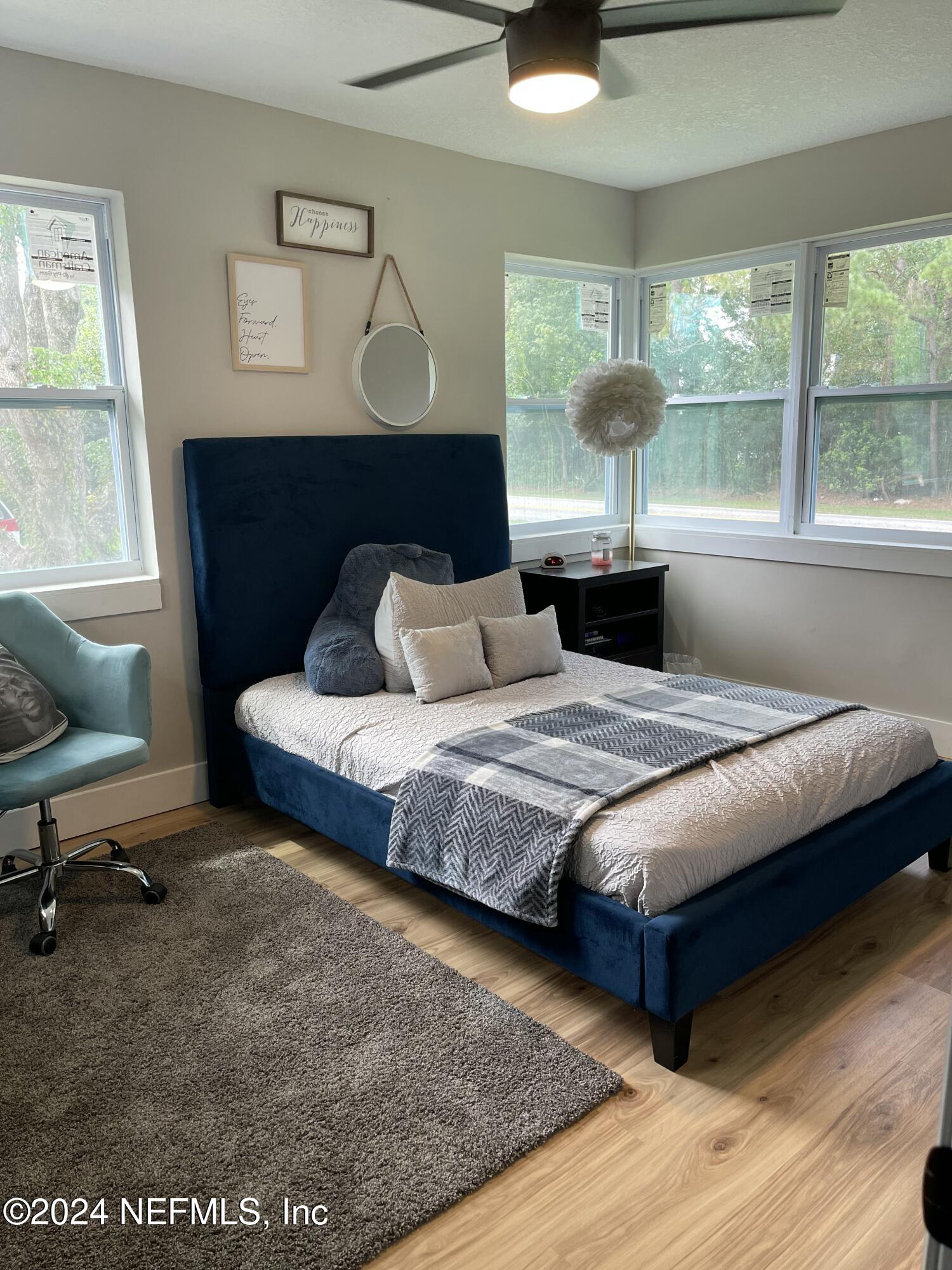 7566 Old Kings Road South Jacksonville, FL 32217 - Photo 23 of 30 a bedroom with a large bed and a window
