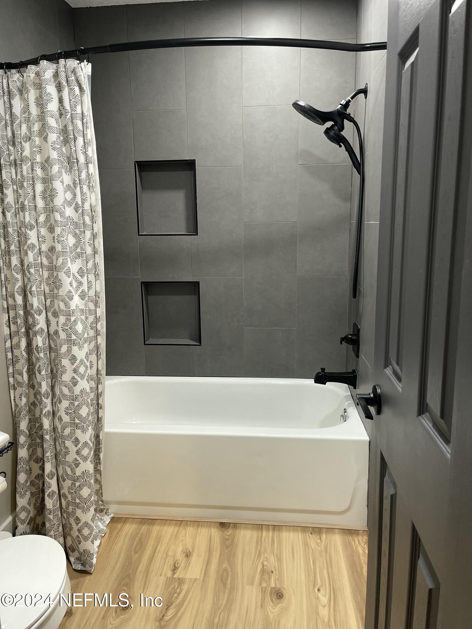 7566 Old Kings Road South Jacksonville, FL 32217 - Photo 24 of 30 a bathroom with a shower and a toilet
