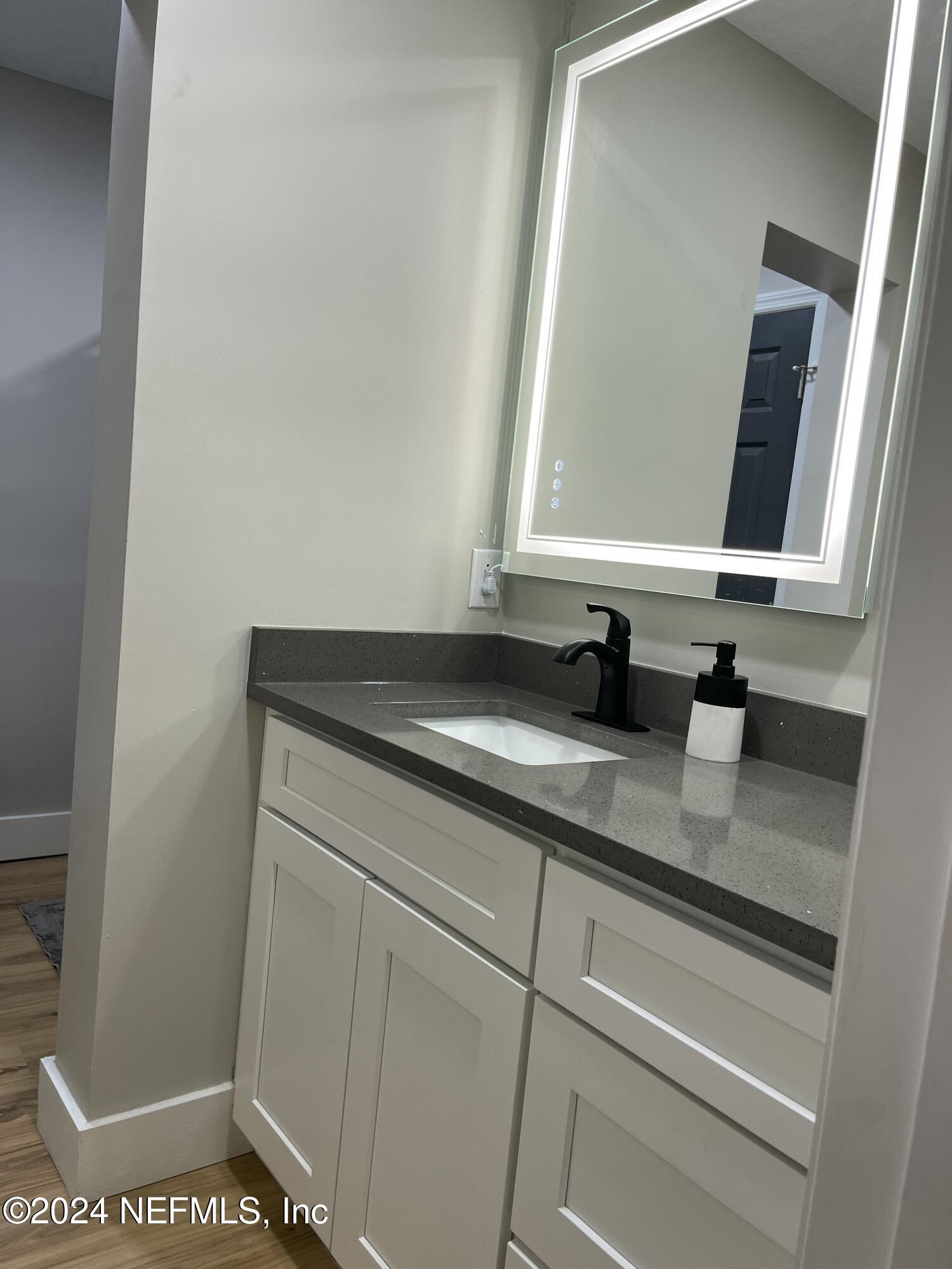 7566 Old Kings Road South Jacksonville, FL 32217 - Photo 25 of 30 a close view of sink and mirror