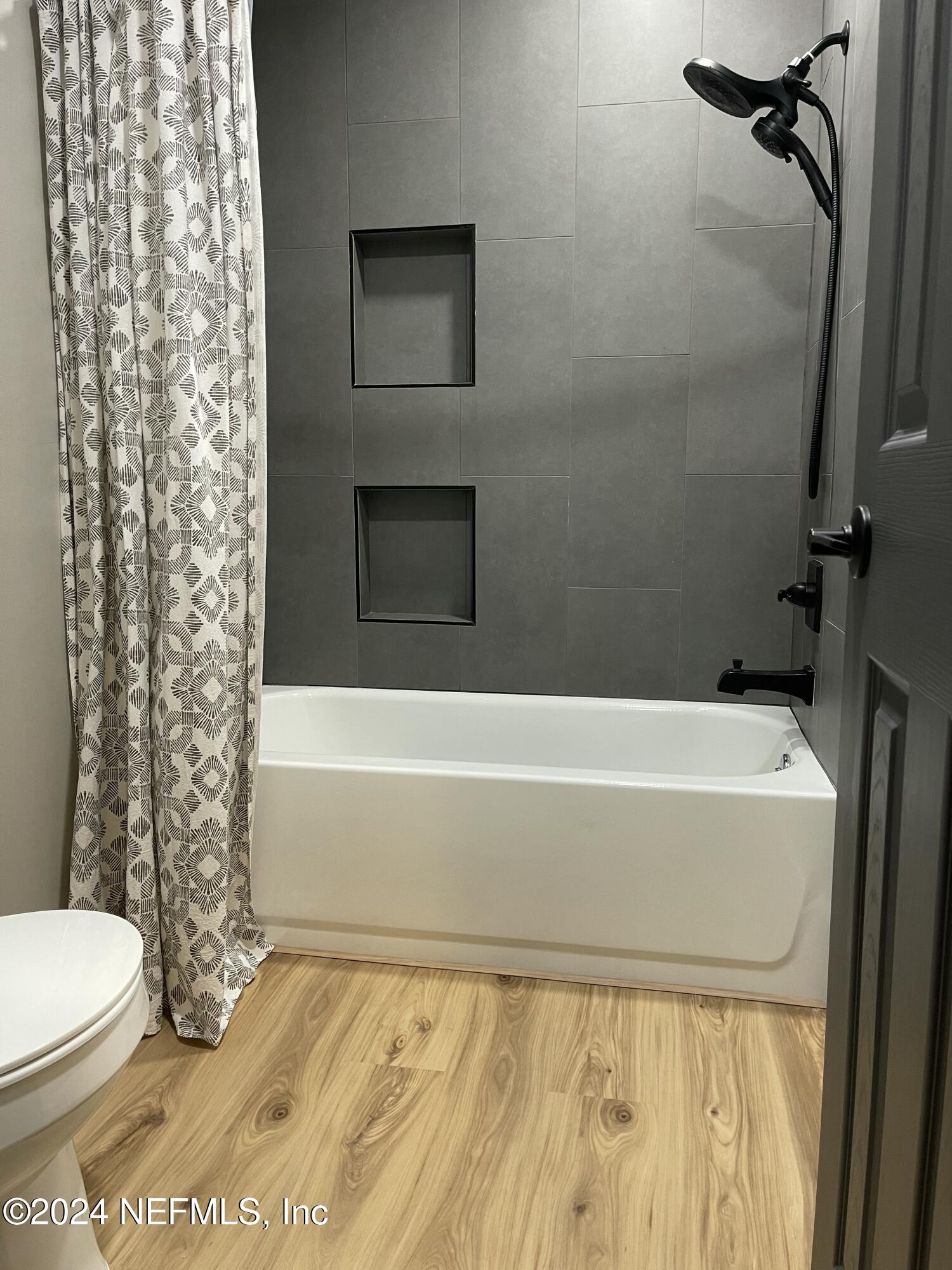 7566 Old Kings Road South Jacksonville, FL 32217 - Photo 26 of 30 a bathroom with a toilet and a shower