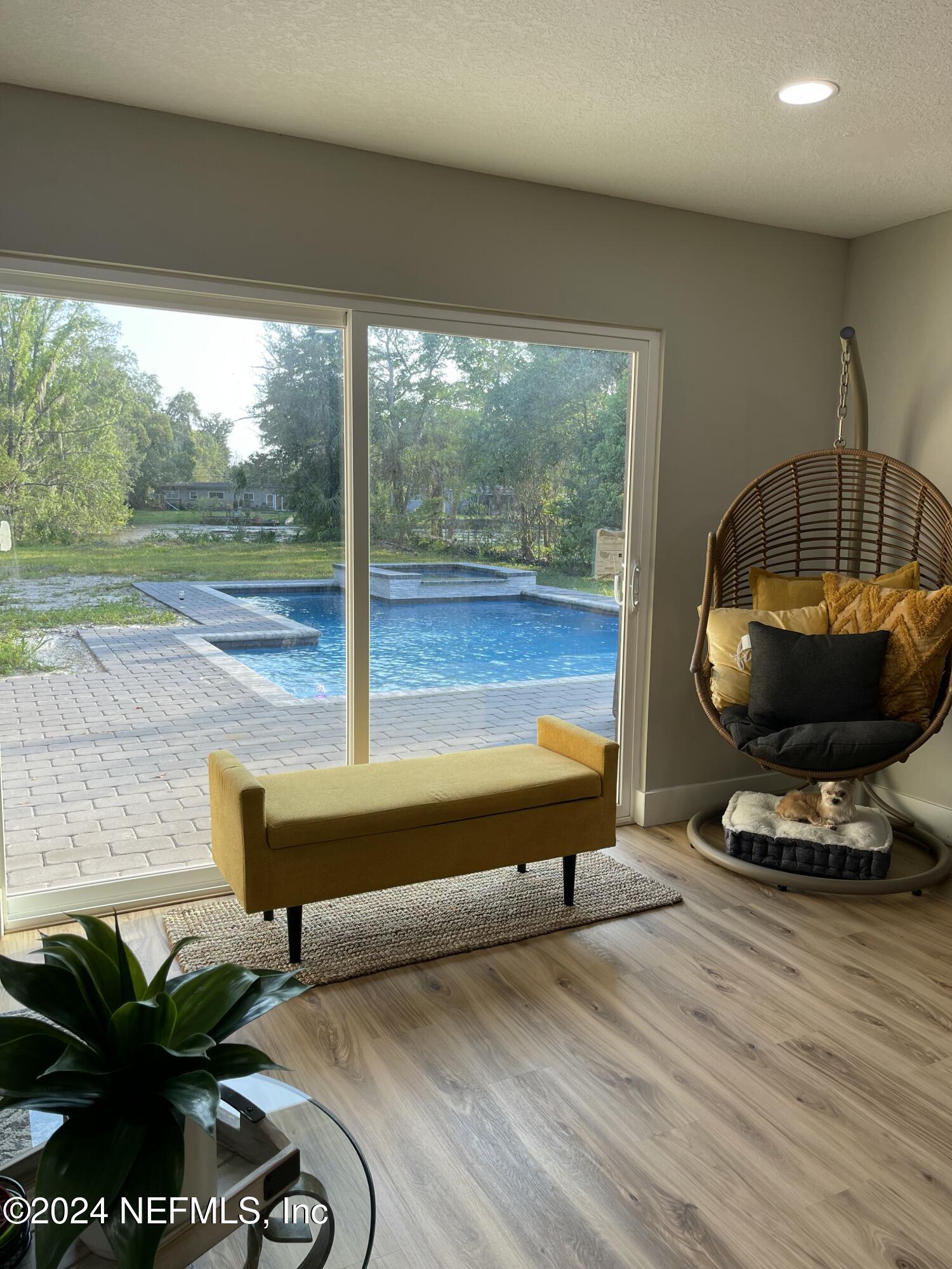 7566 Old Kings Road South Jacksonville, FL 32217 - Photo 5 of 30 a room with pool table and a floor to ceiling window