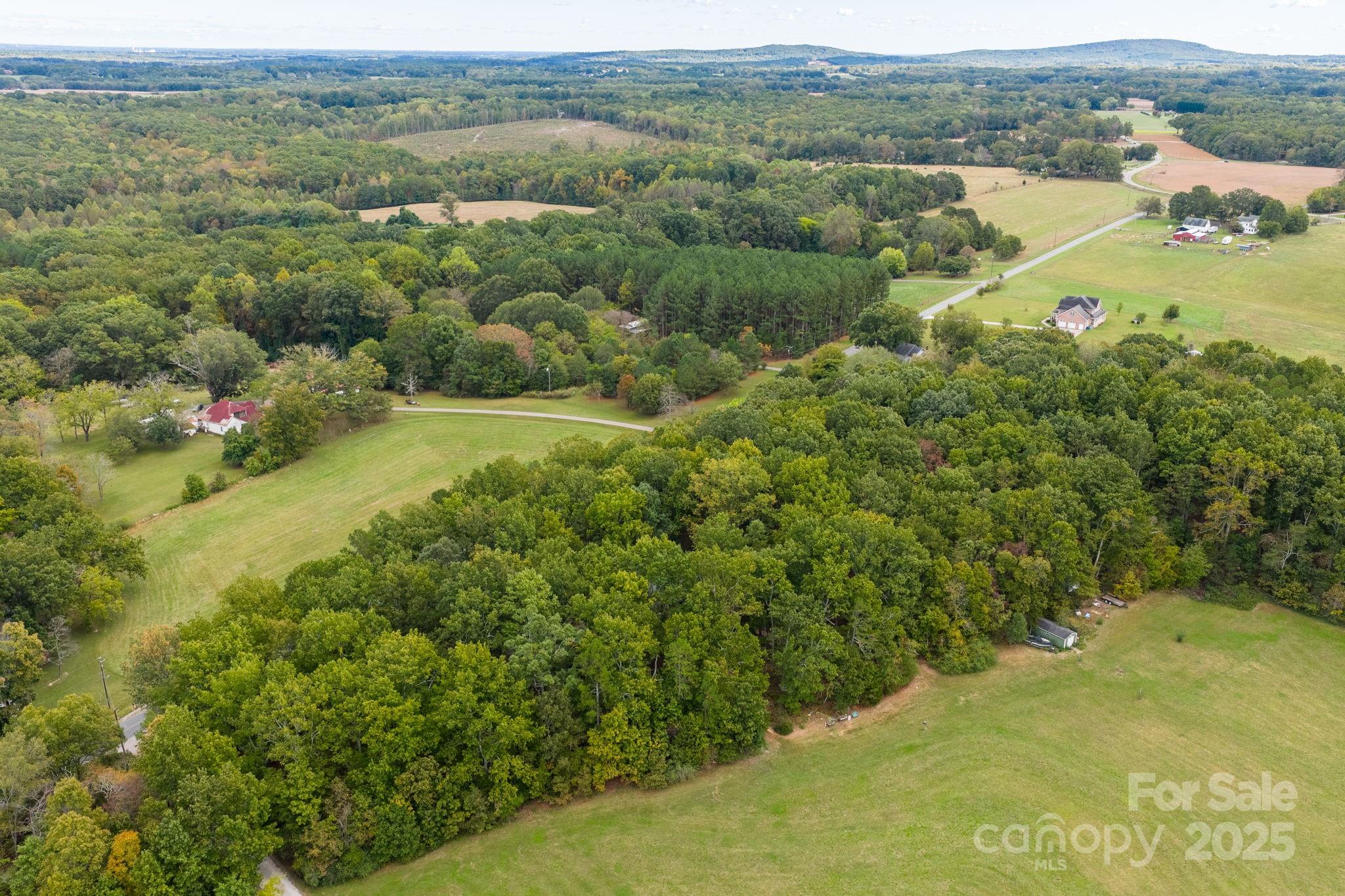 1615 Fox Dairy Road, Unit 12 Newton, NC 28658 - Photo 16 of 35 an aerial view of residential houses with outdoor space and trees