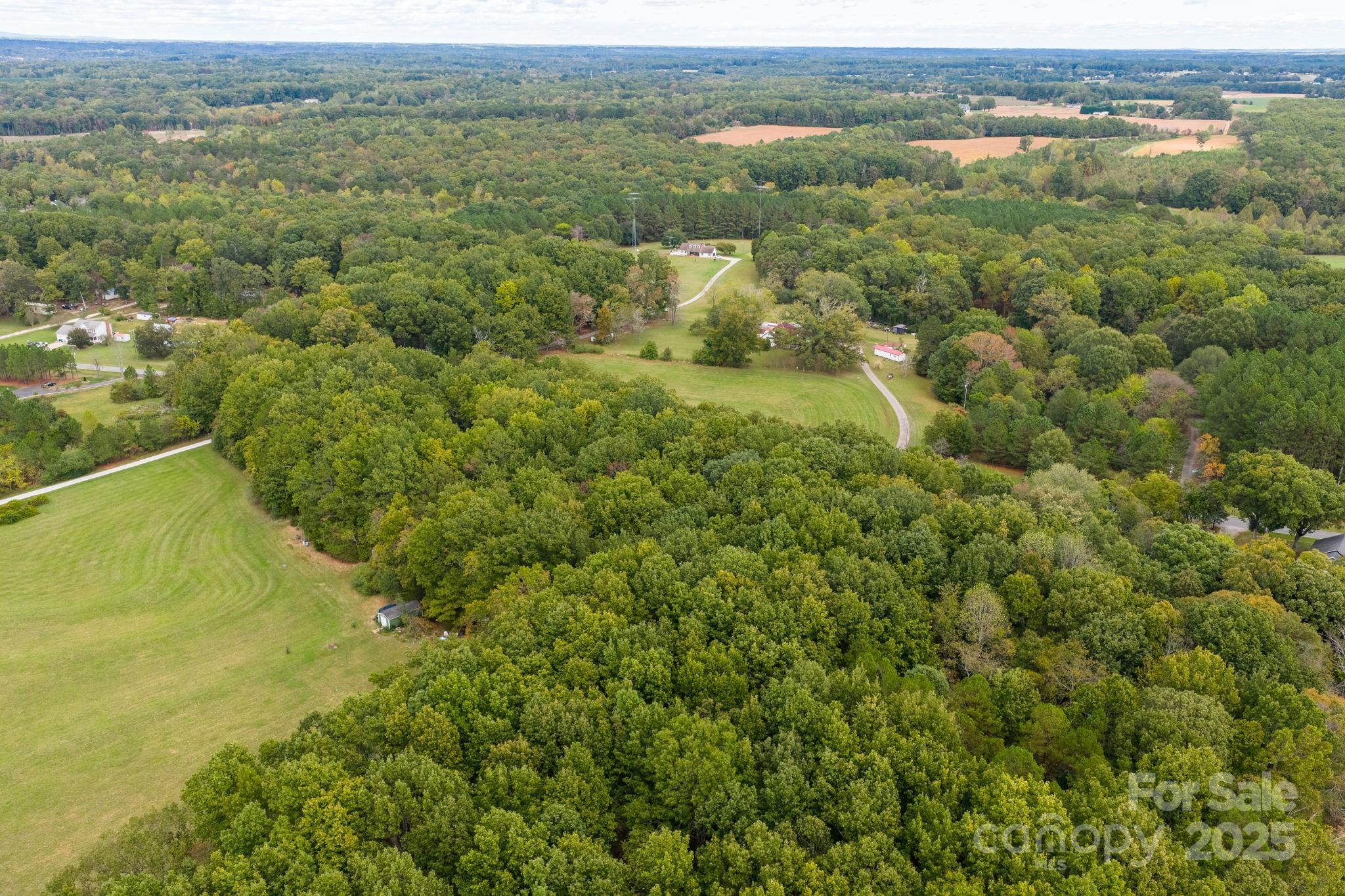 1615 Fox Dairy Road, Unit 12 Newton, NC 28658 - Photo 17 of 35 an aerial view of residential houses with outdoor space and trees