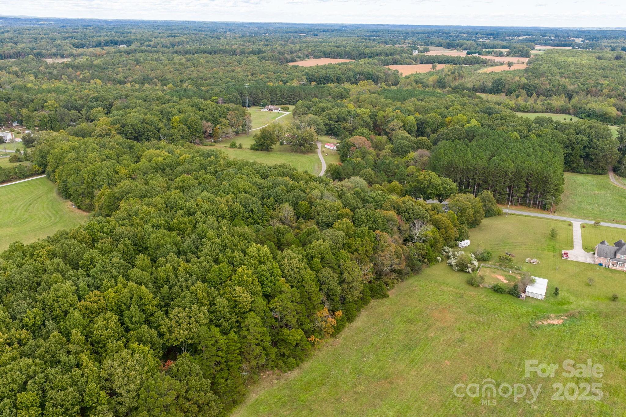 1615 Fox Dairy Road, Unit 12 Newton, NC 28658 - Photo 18 of 35 an aerial view of residential houses with outdoor space and trees