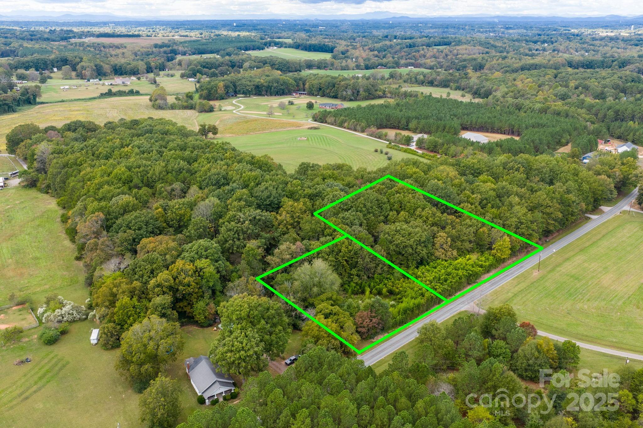 1615 Fox Dairy Road, Unit 12 Newton, NC 28658 - Photo 21 of 35 an aerial view of ocean with residential houses with outdoor space and trees