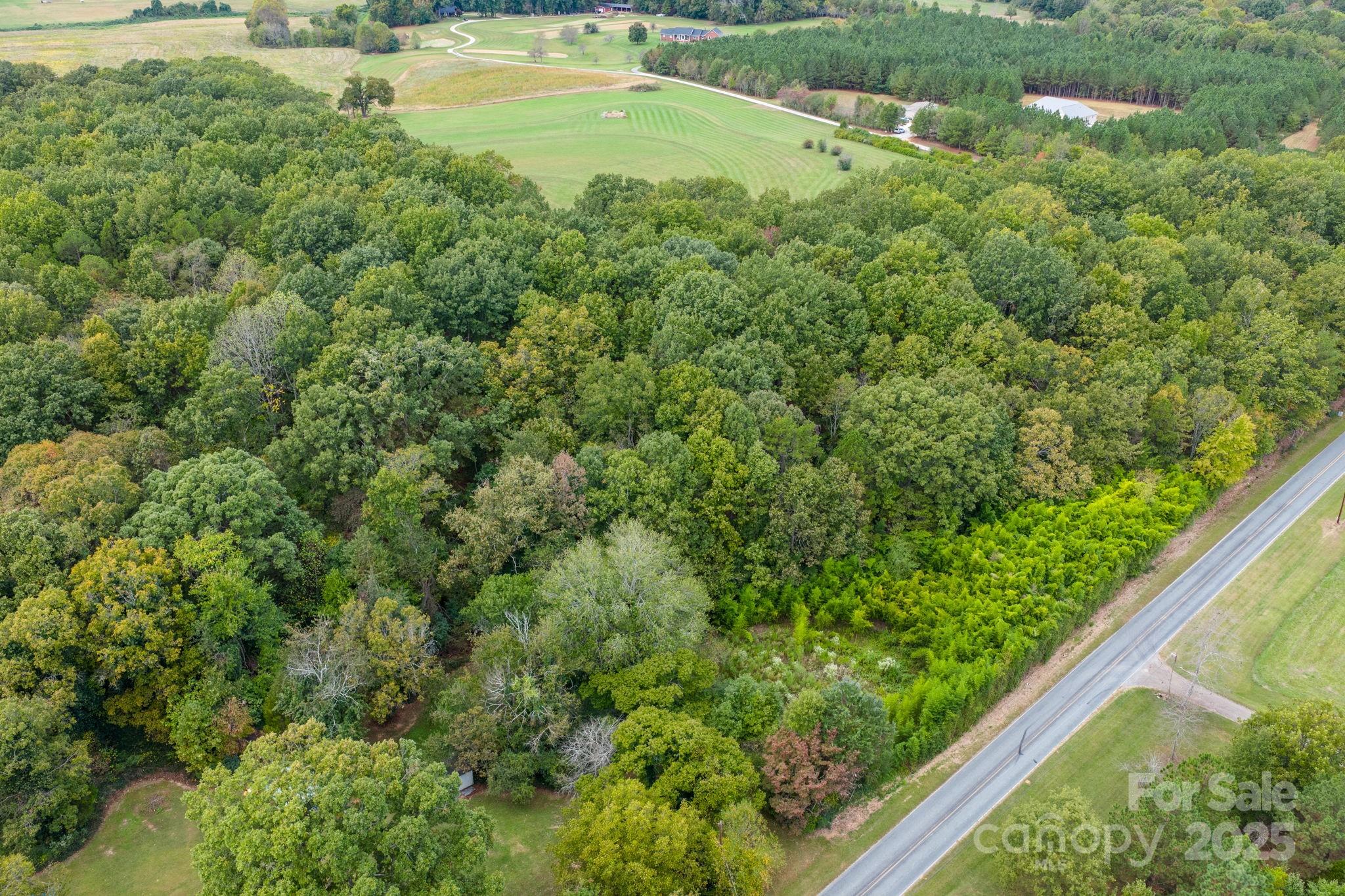 1615 Fox Dairy Road, Unit 12 Newton, NC 28658 - Photo 23 of 35 an aerial view of residential houses with outdoor space and trees