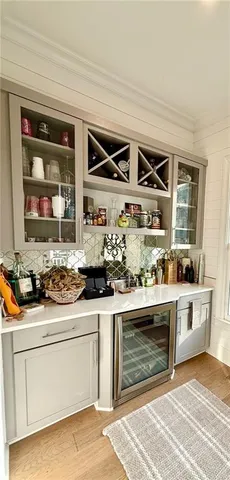 a kitchen with a stove a sink and a window