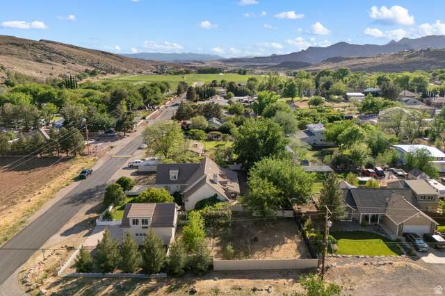 20 Valley Road Leeds, UT 84746 - Photo 50 of 57 Expansive lot featuring a cleared building site, mountain backdrop, and established trees
