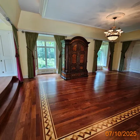 a view of an entryway door with wooden floor