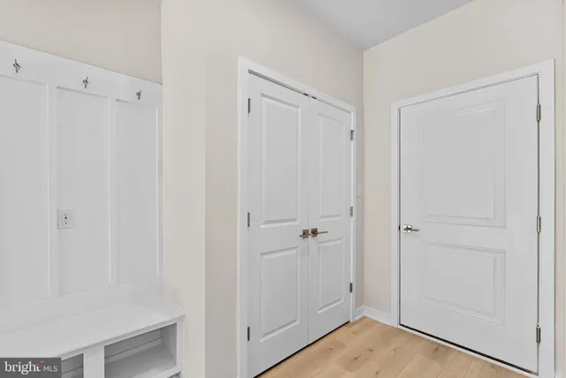 a view of a room with window and wooden floor