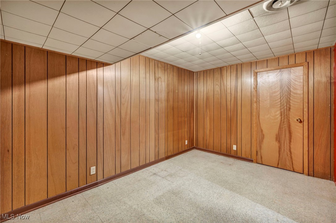 367 High Grove Boulevard Akron, OH 44312 - Photo 35 of 46 Spare room with wooden walls